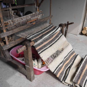 weaving loom with finished blanket